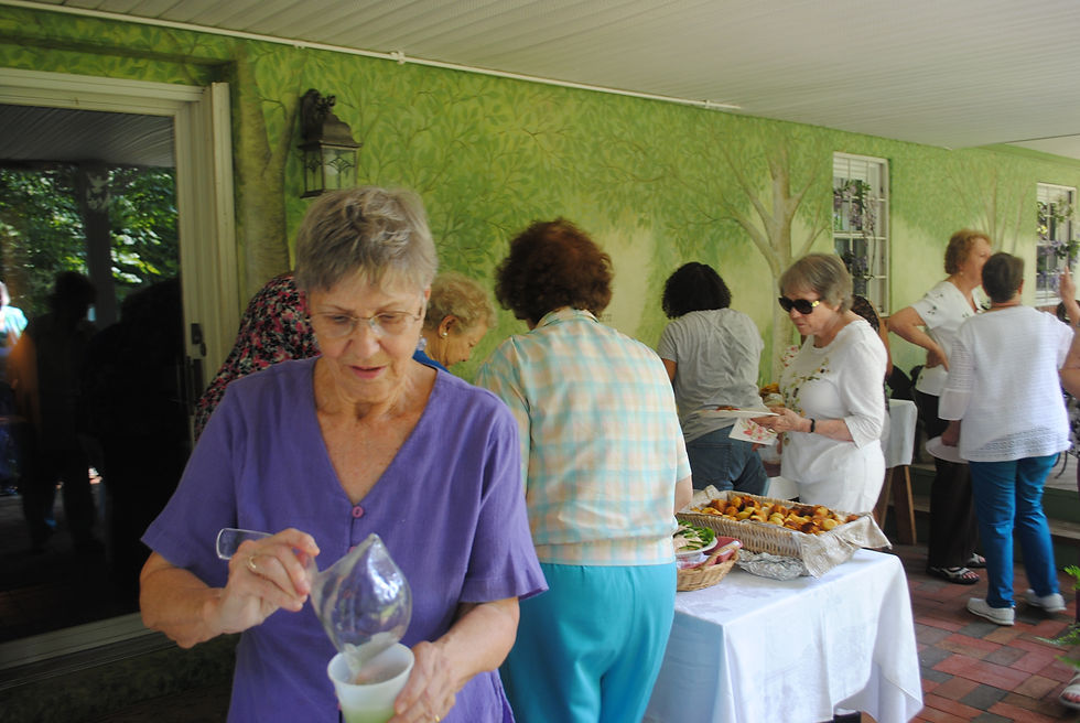 Linda filling the drinks and everyone at