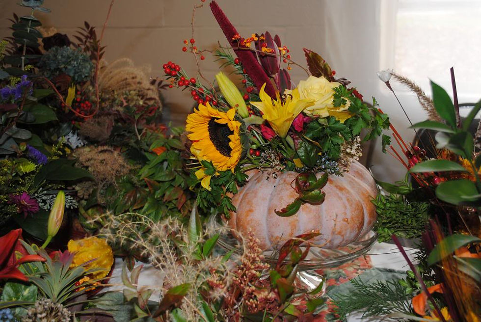 Examples of arrangements for sale at St. Thomas Market (Pam Smart's pumpkin arrangement)