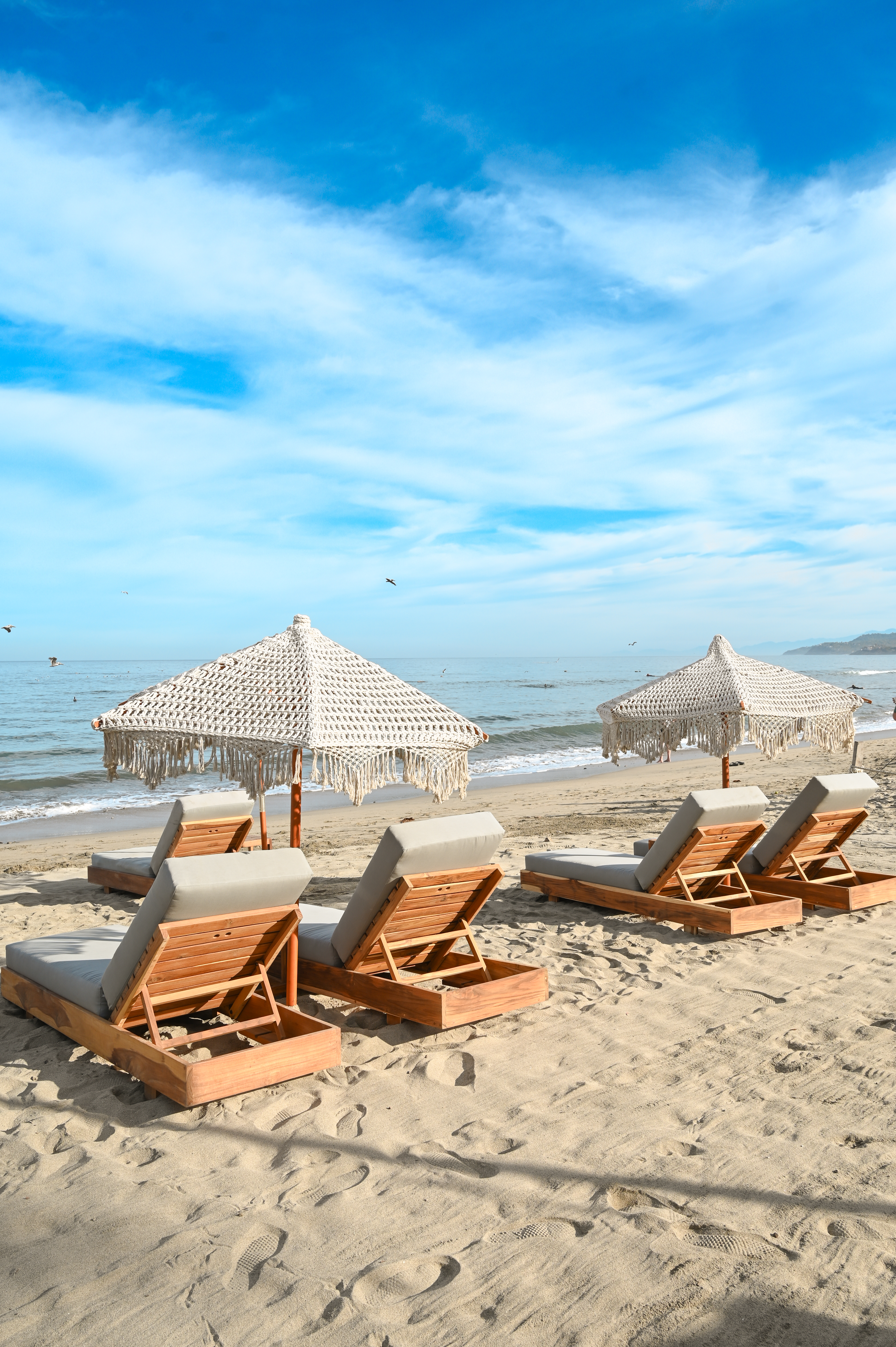 Beachfront lounge chairs at Goat Beach Club Sayulita