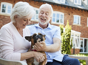 Palisade Gardens Independent Living - smiling couple with dog
