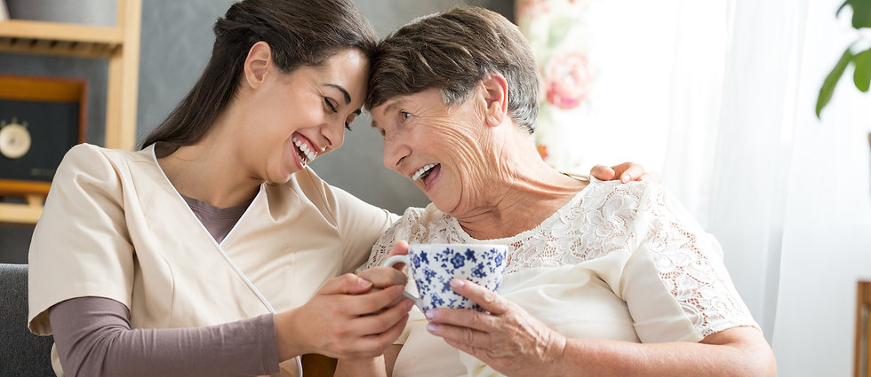 Palisade Gardens staff and resident laughing