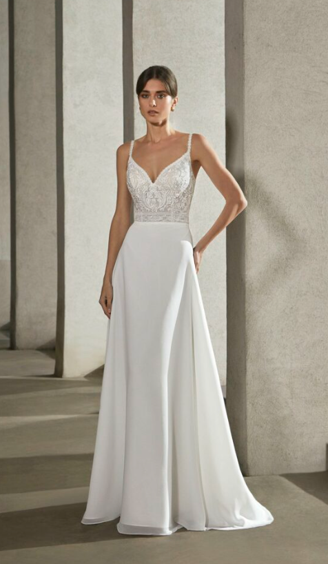 A wedding dress that’s the best of both worlds – blending geometric and floral lace embroidery. Finished with a chiffon A-line skirt for that extra wow factor!