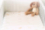 Close-up view of Silk Bubs baby shampoo bottle on a soft white towel