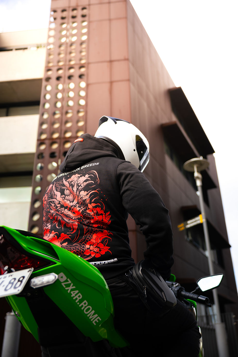 Rider wearing a branded hoodie by DMFS