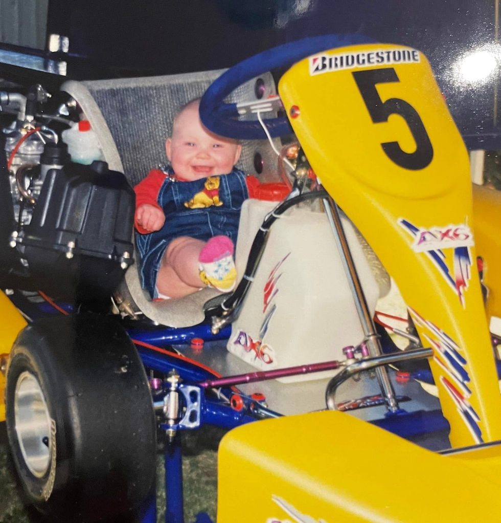 Ace Media Founder Alyce as a baby sitting in a go kart.