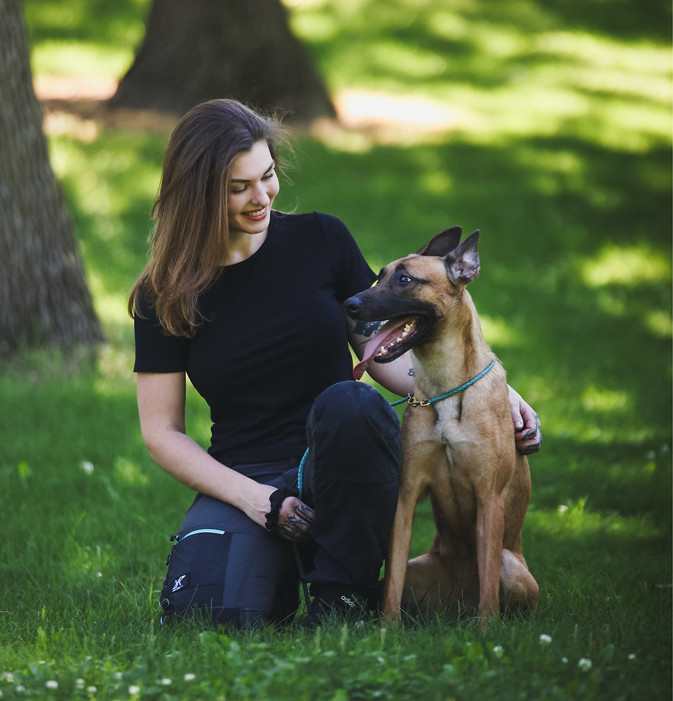 Ryleigh and Boomslang, her Belgian Malinois