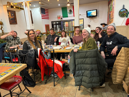 A group of Philly dog walkers eat tacos.