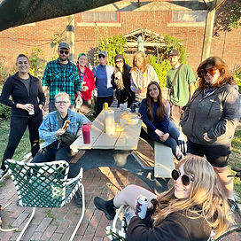 A group of dog walkers hangs out in a community garden in Philadelphia