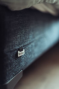 Close-up detail of M-Line beds/boxspring at Arrivée, showcasing luxurious comfort and quality craftsmanship.