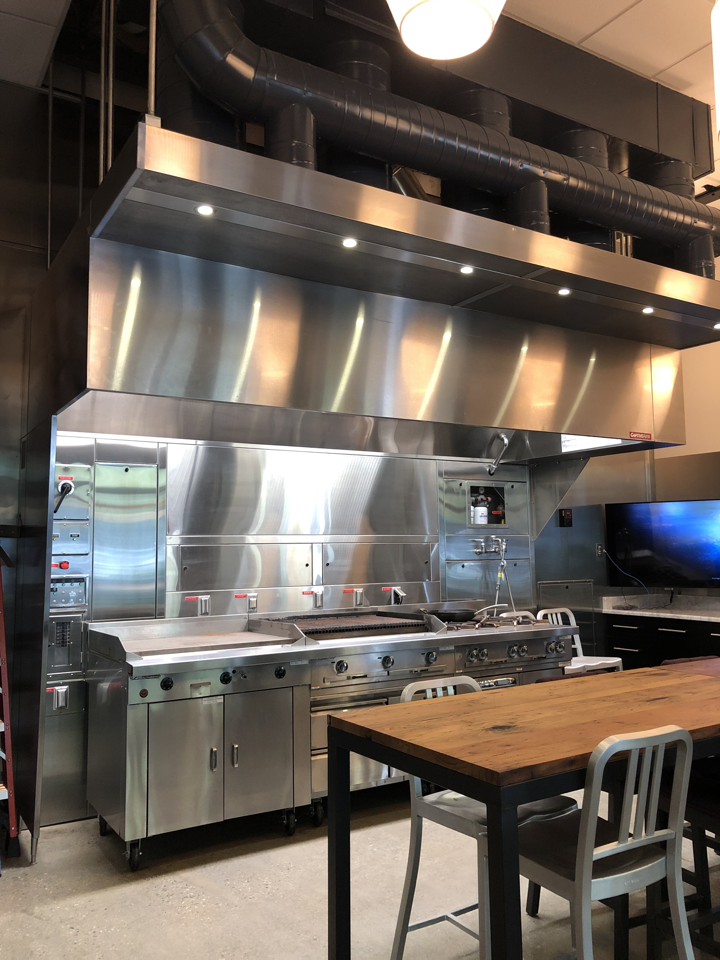 Commercial kitchen exhaust hood with makeup-air plenum and overhead ductwork