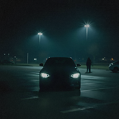 mysterious car in a dark parking lot