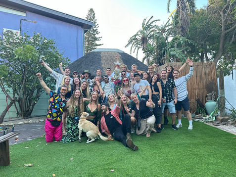 Guests posing for a photo in the garden.