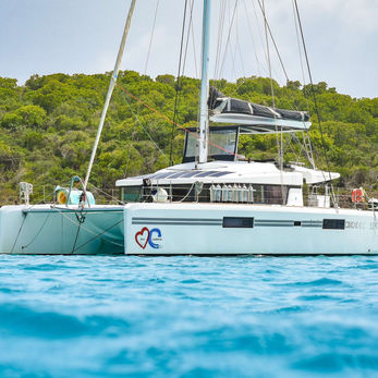 A catamaran , showcasing a serene maritime scene under clear skies.
