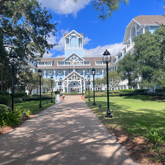 Blue building surrounded by greenery