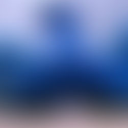 Large blue hat with 2 kids standing under