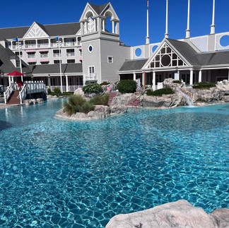 Grey building with beautiful blue water