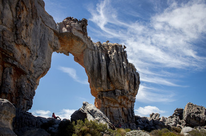 Hiker sitting beneath the Wolfberg Arch.