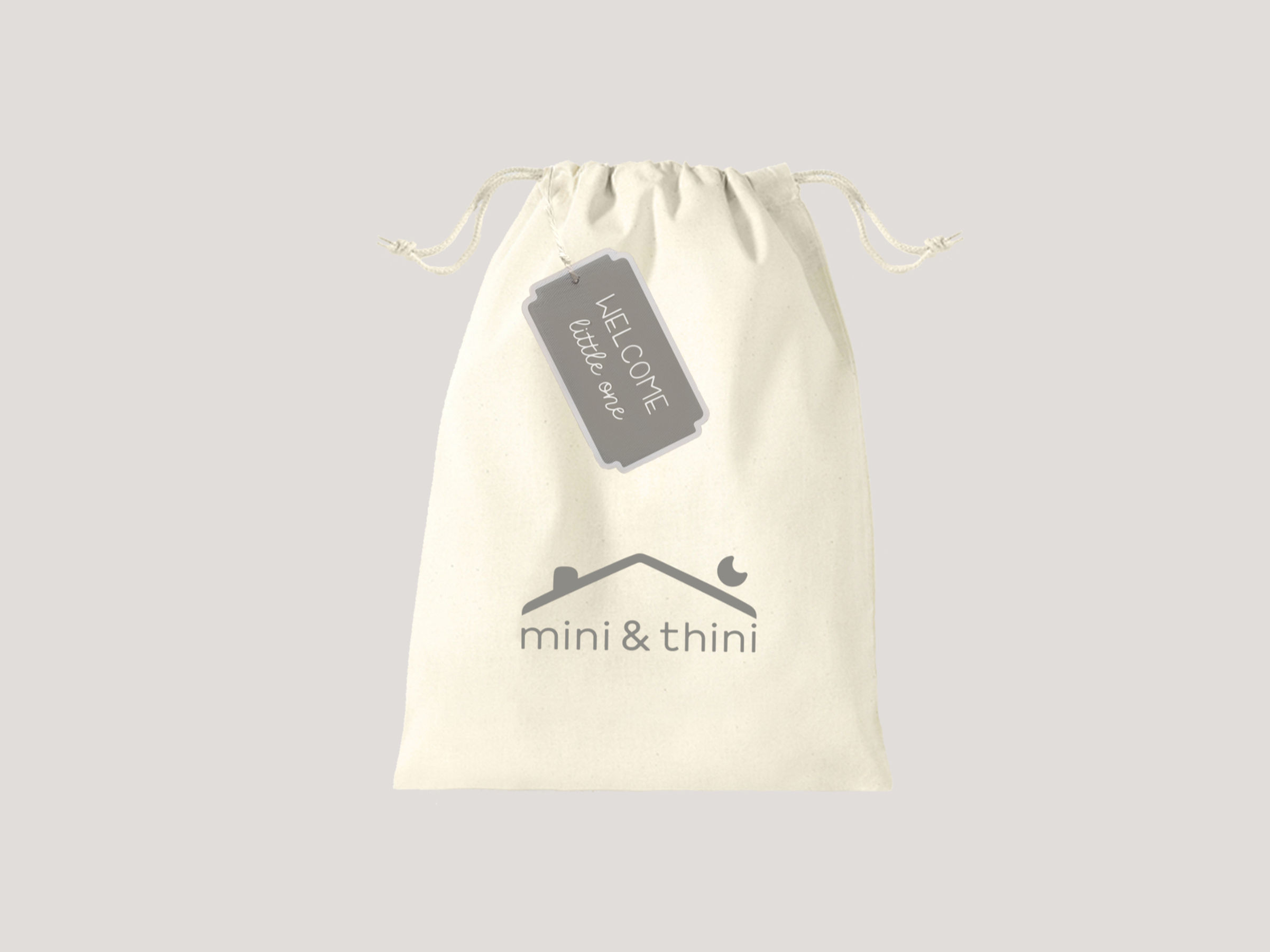 Gift wrapping with Welcome Little One gift tag