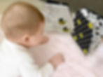 Baby during tummy time looking at My Quiet Book, High-contrast Soft Book