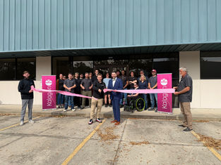 Kalogon Raises $5.75M: Kalogon team ribbon cutting ceremony in front of Kalogon offices in Melbourne FL