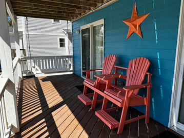 Mid-level deck with swing for relaxing by young and old.