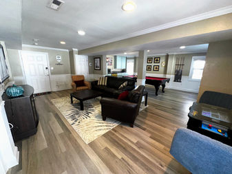 Recreation room with pool table and cocktail table style video gaming. Full sized refrigerator and microwave for added convenience.