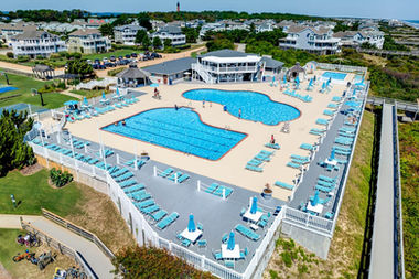 Corolla Light Resort Oceanfront complex. four pools including baby pool, lap pool, sunbathing pool decks, on-site Oceanfront Grille with full food & beverage service. Snack hut for quick drinks and treats