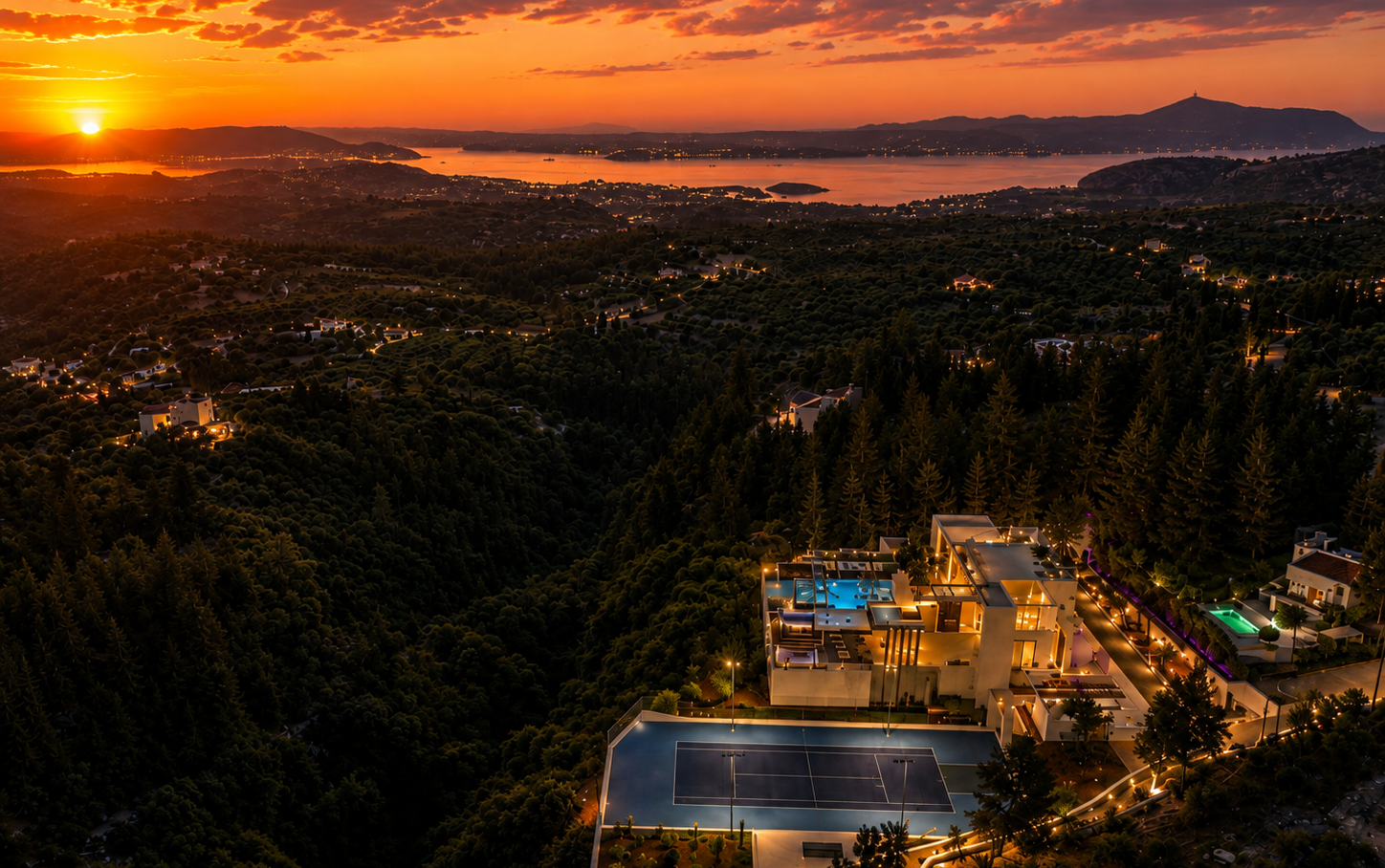Aerial sunset view of The One Villa Crete surrounded by private forest with panoramic sea views in Chania, Crete