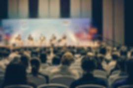 rear-view-audience-listening-speakers-stage-conference-hall-seminar-meeting.jpg