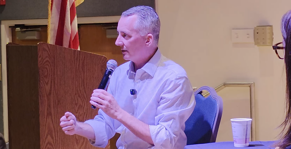 David Jolly, Florida Gubernatorial candidate speaks at an Indivisible Boca Raton forum. With him is Senator Tina Polsky.