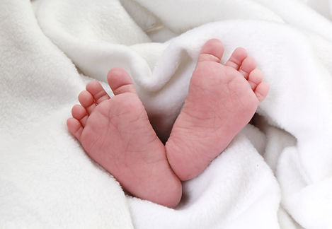 baby feet shaped into a heart