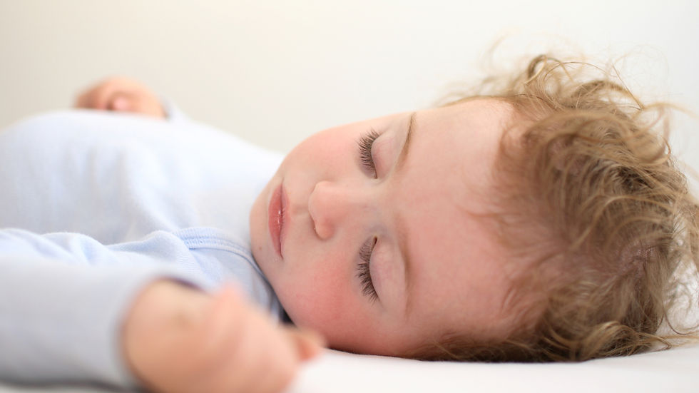 Child sleeping peacefully after establishing a consistent bedtime routine.