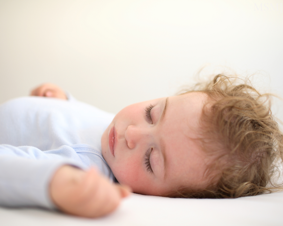 Child sleeping peacefully after establishing a consistent bedtime routine