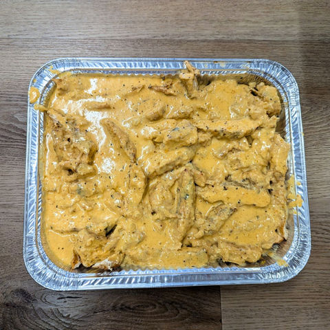 Down south chicken catering pan with creamy cajun sauce for events in Burlington, Mebane, Greensboro, and everywhere in between.