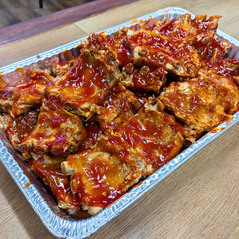 Baby back ribs catering pan for events in Burlington, Mebane, Greensboro, and everywhere in between.