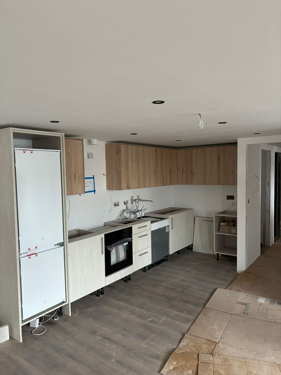 Eye-level view of a dated kitchen with old cabinetry and appliances