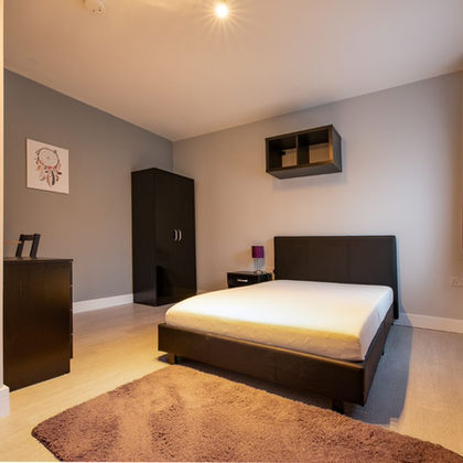 Modern furnished bedroom, DBR Investment Group