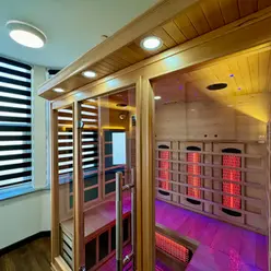 Modern infrared sauna with pink lighting