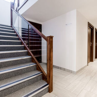 Modern staircase and hallway with glass railing