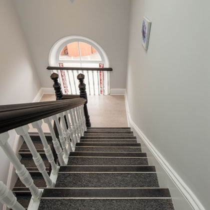 Elegant staircase leading to upper floor