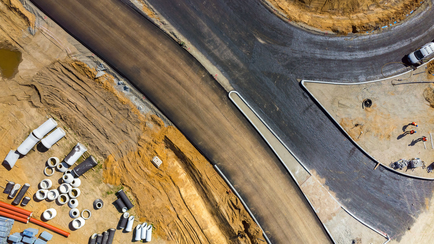 Aerial view of road construction, concrete and dirt. Construction Progress Monitoring. drone construction monitoring.