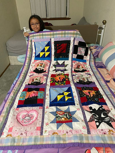 Riley with her Quilt Oct 2025.jpeg