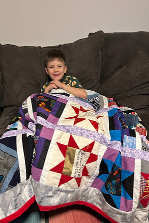 Gus with his quilt Dec 9 2024.jpg