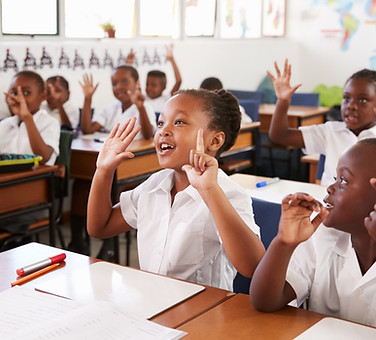 Kids showing hands during a lesson at an elementary school.jpg