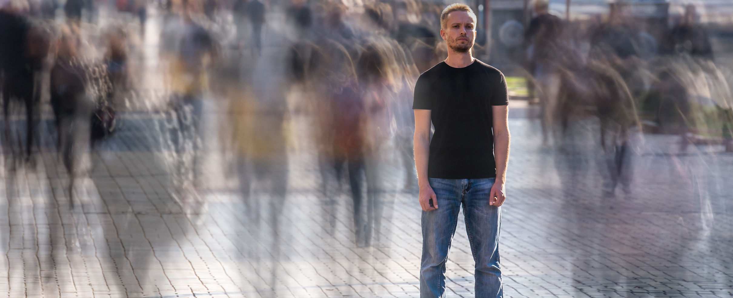the-man-stands-on-the-crowded-street-2023-11-27-05-14-24-utc.jpg