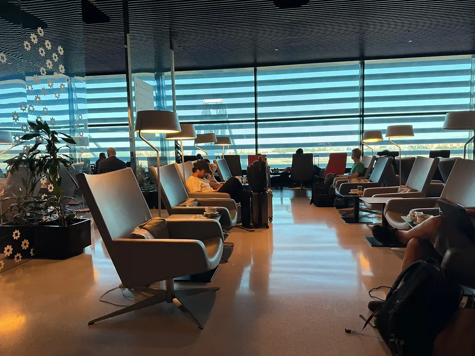 ANA Lounge at Lisbon Airport Terminal 1, seating area with lounge chairs and view over the tarmac, tested with Saily Ultra DragonPass access