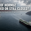 Strait of Hormuz shipping crisis 2026: oil tanker transiting the strait as commercial traffic collapses following Iran-US conflict.
