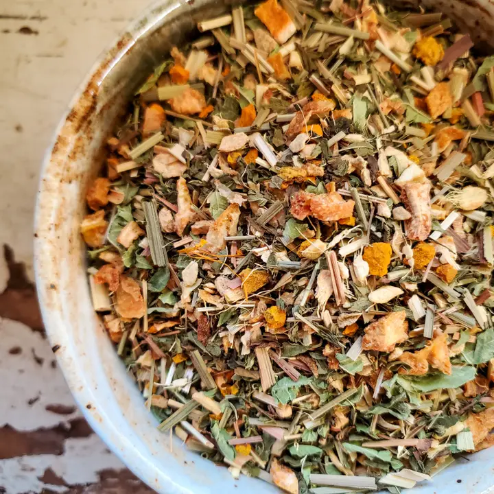Gnat and Bee Lemon Gingerly herbal loose tea with citrus peel and spices in a bowl