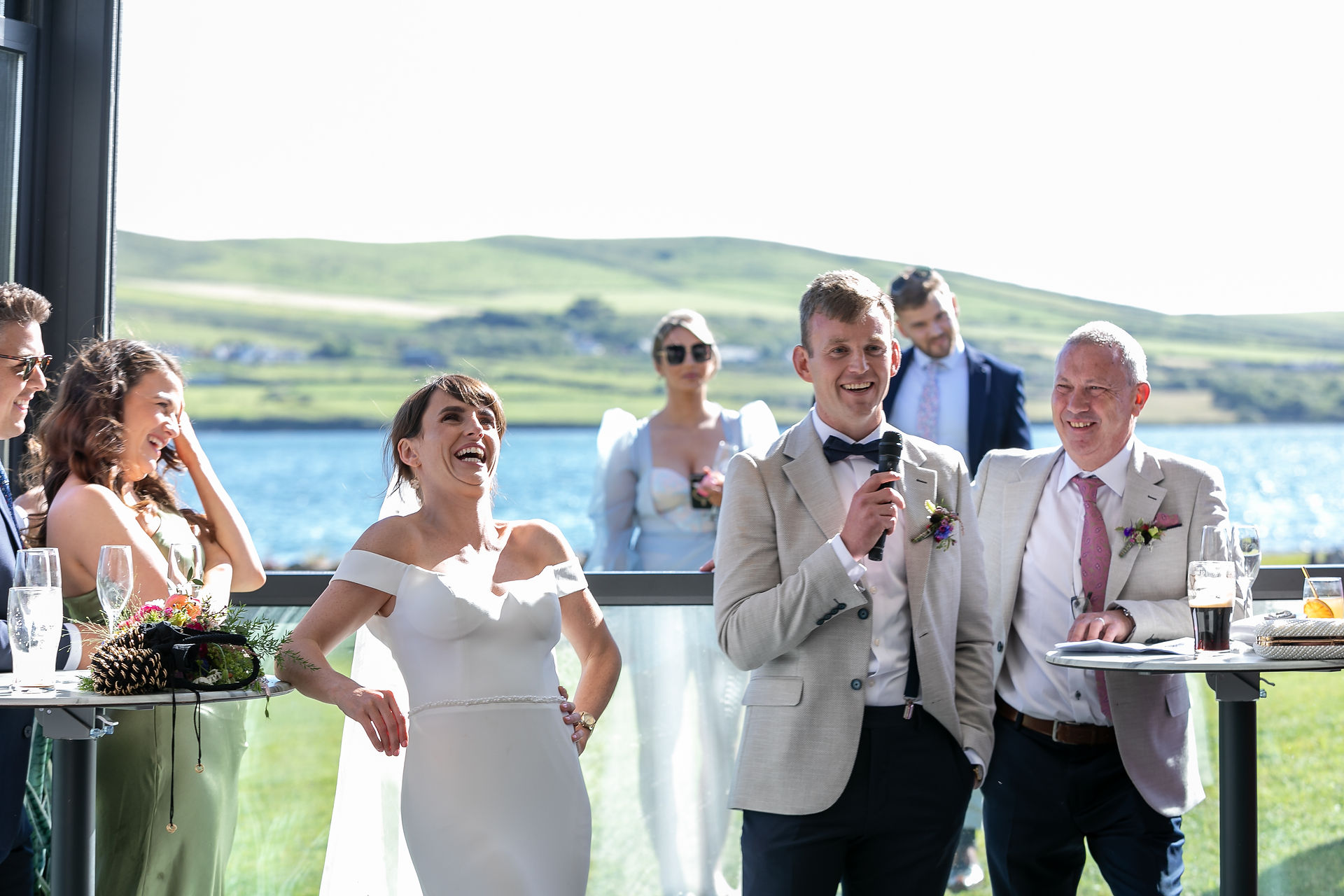 bride laughing at grooms speech 