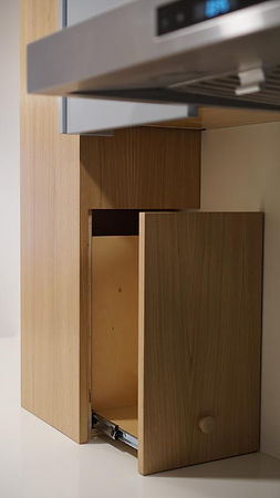 Custom hidden cabinetry with smart storage solutions for a modern Vancouver apartment renovation